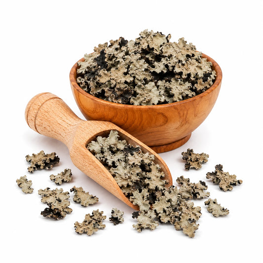 Wooden bowl and scoop filled with a natural scrub on a white background