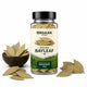 Jar of Orgaan Spices organic bayleaf with leaves around on a white background