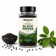 Jar of Orgaan organic black pepper with black pepper in a bowl and green leaves on a white background