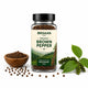 Bottle of Orgaan Organic Brown Pepper with pepper grains and leaves on a white background