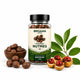 Jar of Orgaan organic nutmeg with nutmeg fruits and leaves on a white background