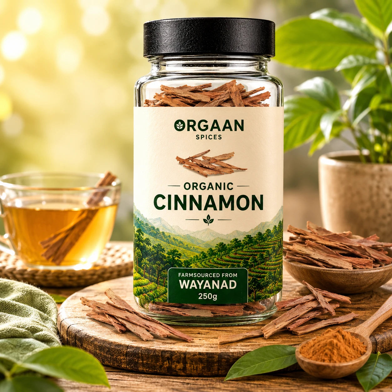Jar of Orgaan Spices organic cinnamon with cinnamon sticks and a cup of tea on a wooden surface.